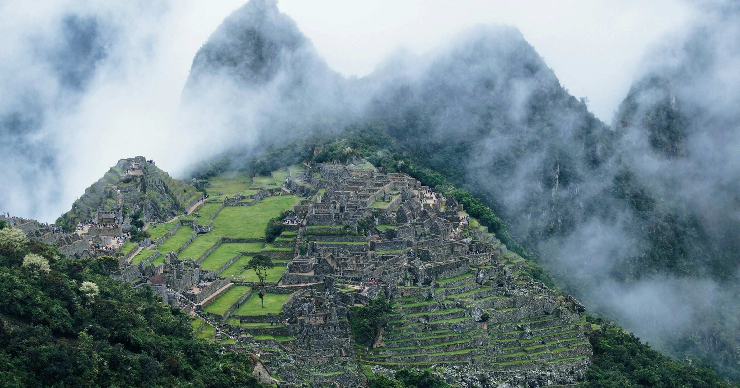 Misty Machu Picchu ruins in the Peruvian Andes — a flagship destination for affordable South American travel