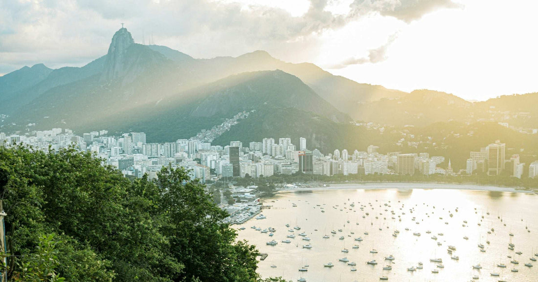 Sunset view over Rio de Janeiro with the silhouette of Christ the Redeemer, Sugarloaf Mountain and Botafogo Bay — the destination for Brazil's Carnival.