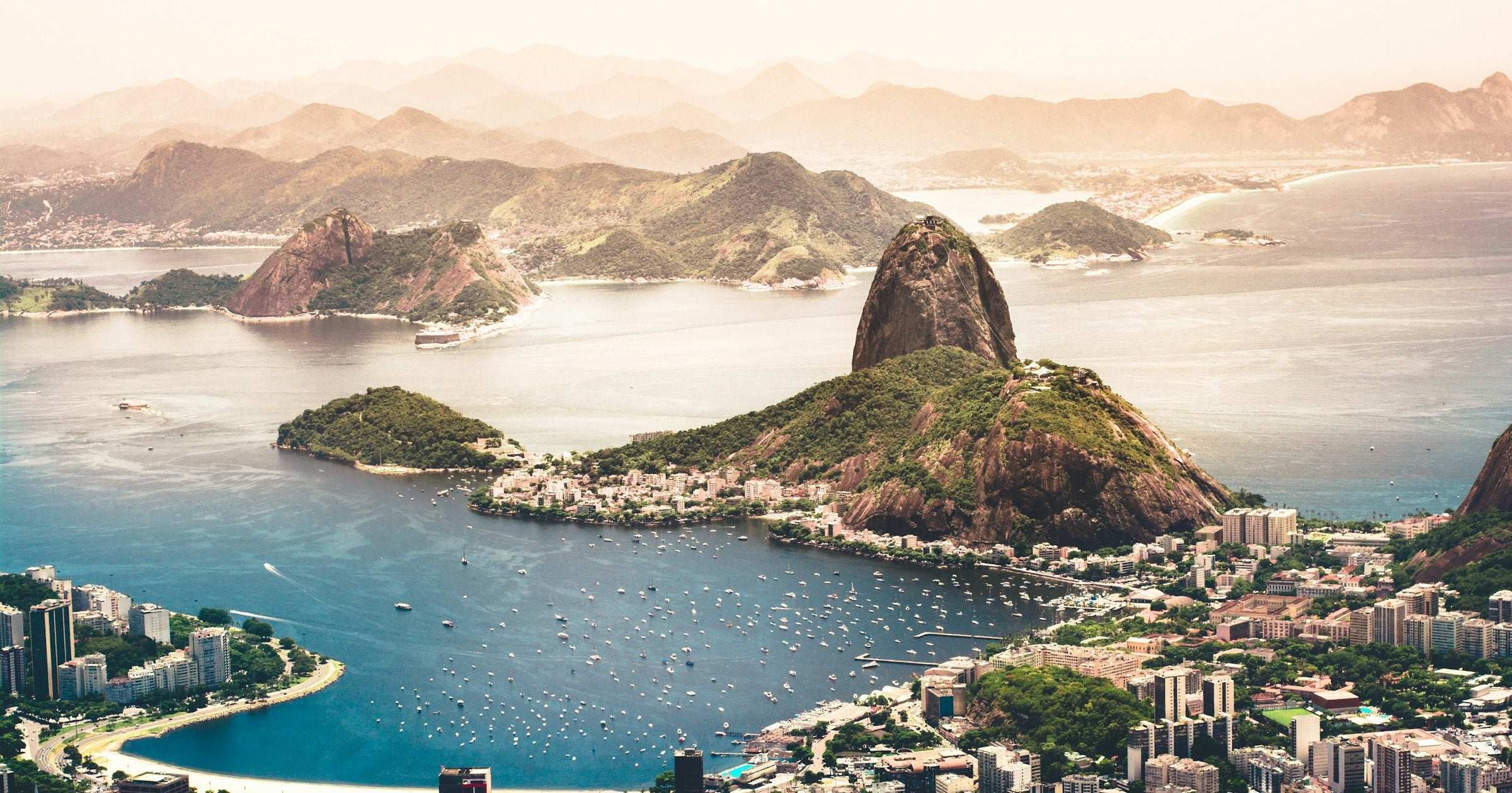 Aerial view of Rio de Janeiros Guanabara Bay with Sugarloaf Mountain and the citys urban coastline