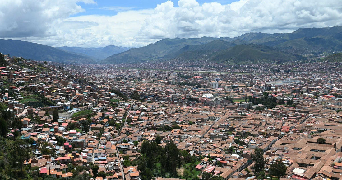 Sprawling terracotta-roofed Latin American cityscape nestled in an Andean valley