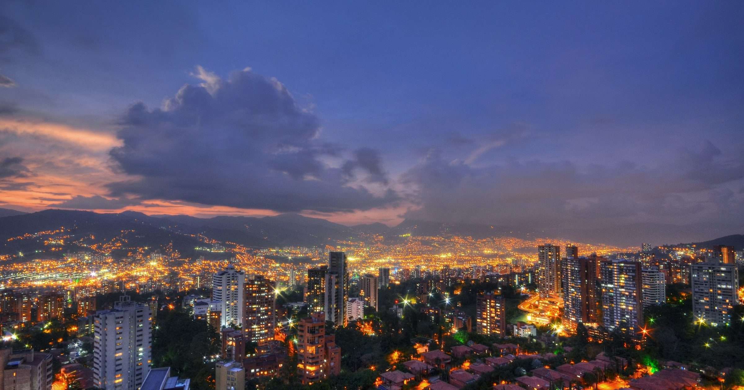 Medellin city lights at dusk in the Aburra Valley, Colombia