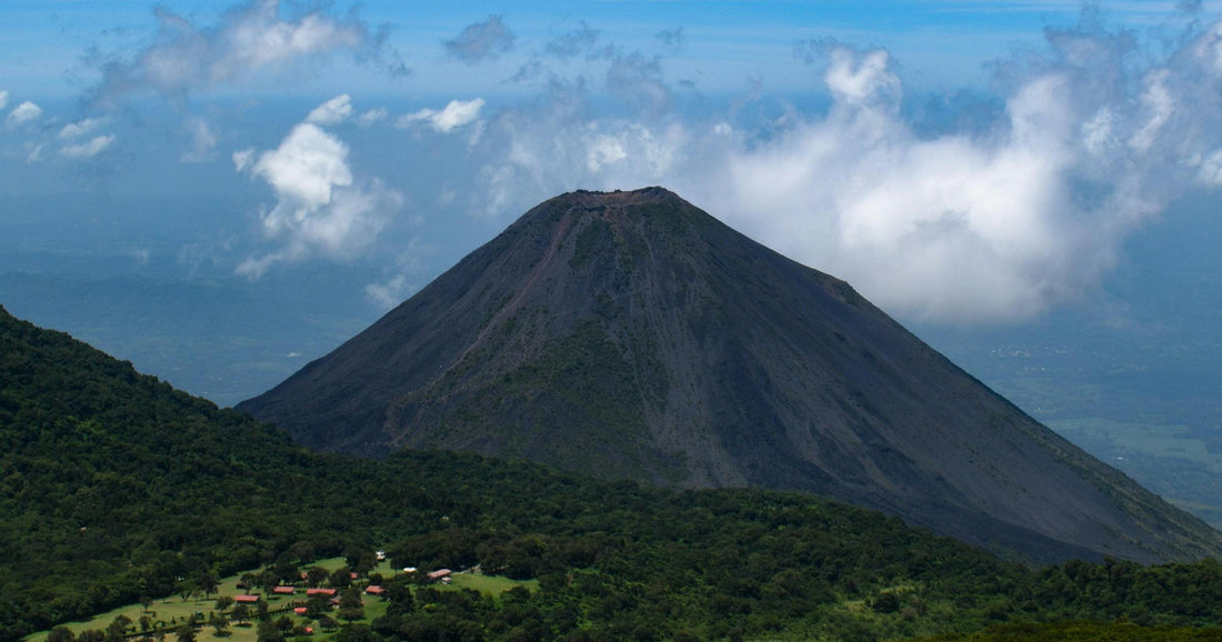 Izalco volcano rising above lush green hillsides in El Salvador — one of the countrys most iconic landscapes