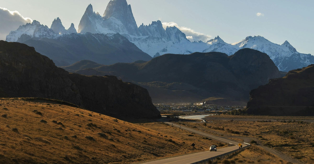 Traveller driving a road toward the Fitz Roy peaks in Patagonia, South America