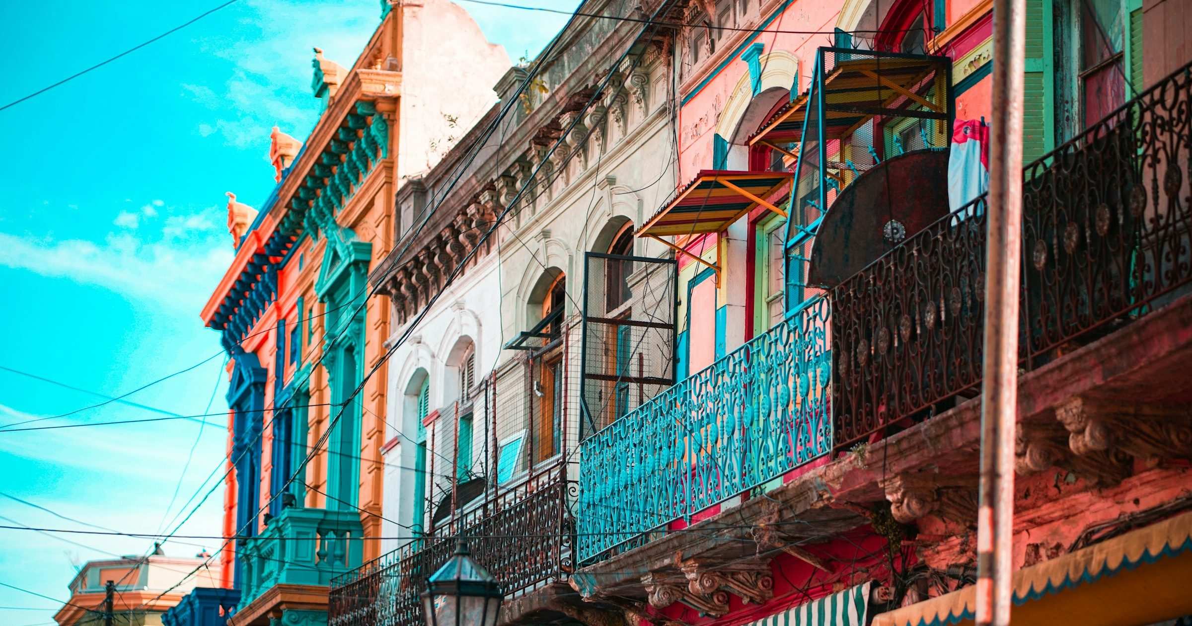 Brightly painted La Boca balconies along a Buenos Aires street — popular destination for travellers staying connected with an Argentina eSIM.