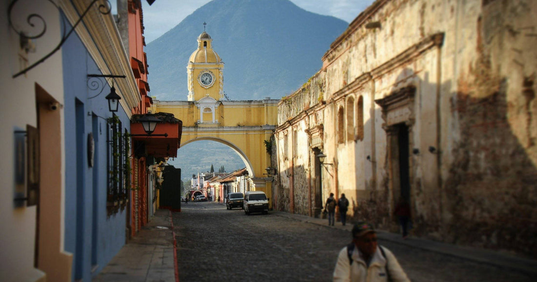 Santa Catalina yellow arch in Antigua Guatemala with Volcan de Agua in background