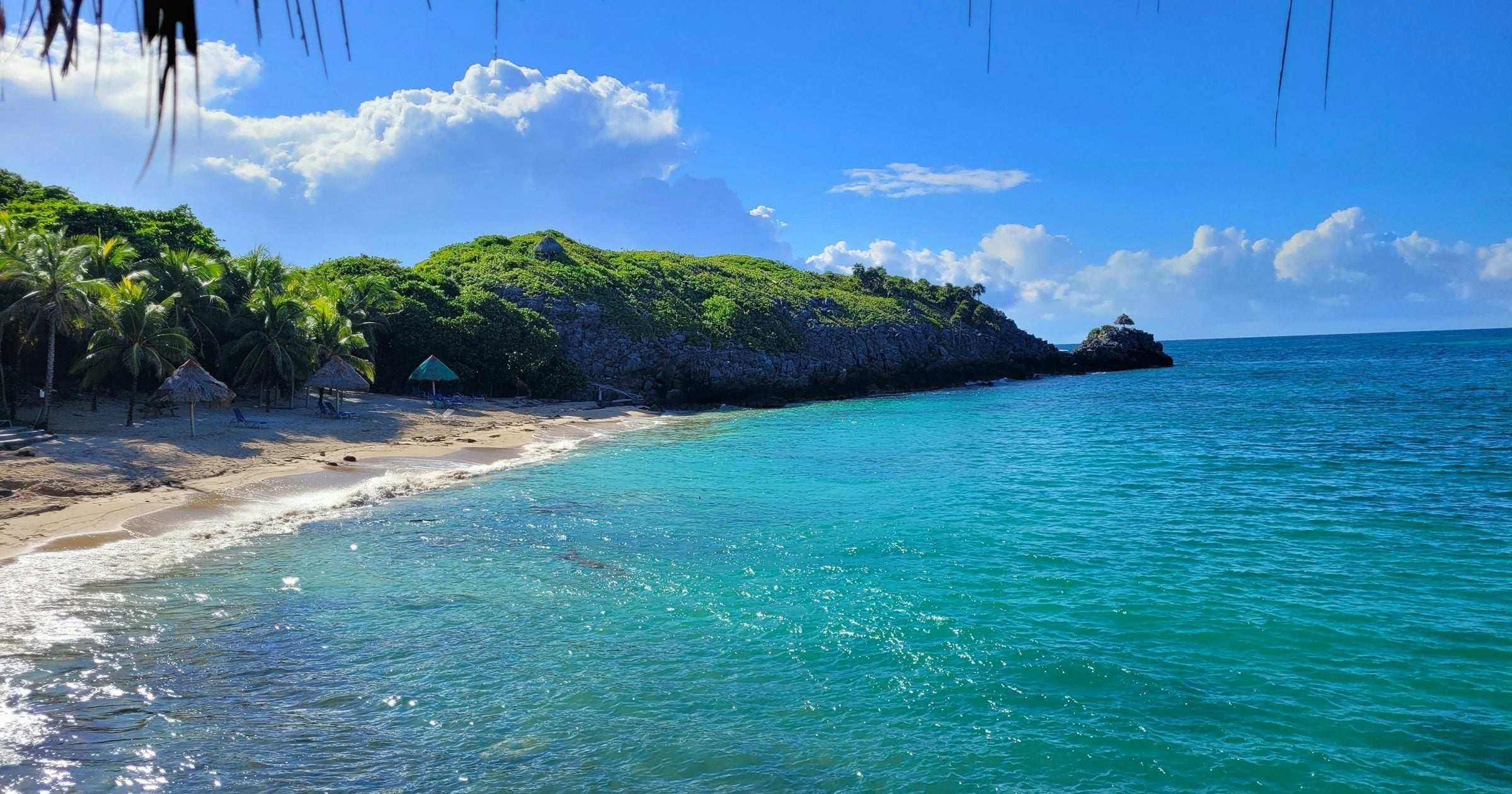 Tropical Caribbean beach with turquoise water in Roatan Bay Islands Honduras