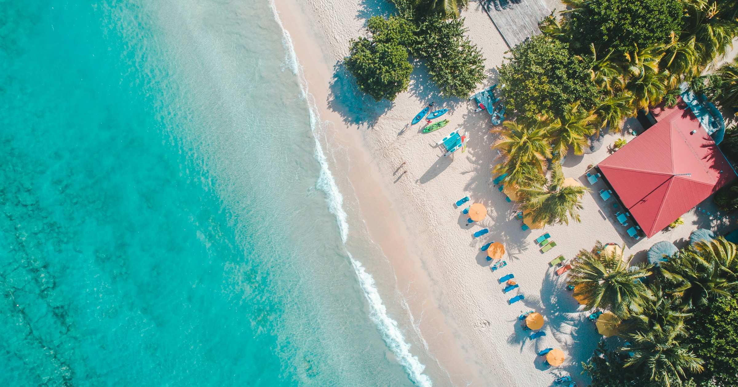 Aerial view of a white-sand beach and turquoise sea in Guadeloupe, French Caribbean