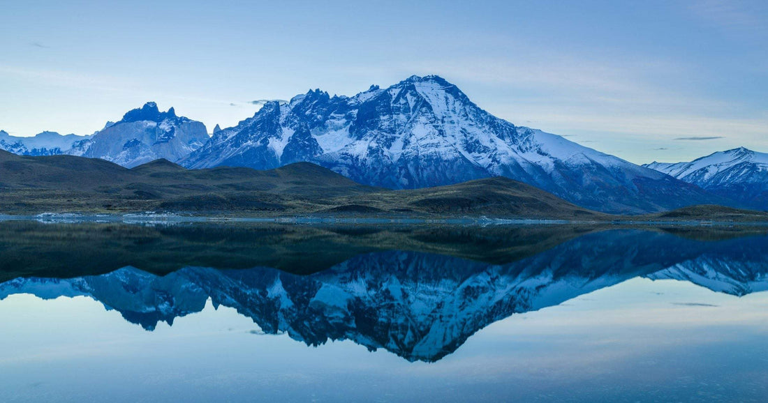 Snow-capped peaks of the Torres del Paine reflected in a glacial lake in Chilean Patagonia — a quick guide to eSIM coverage across South America in 2026.