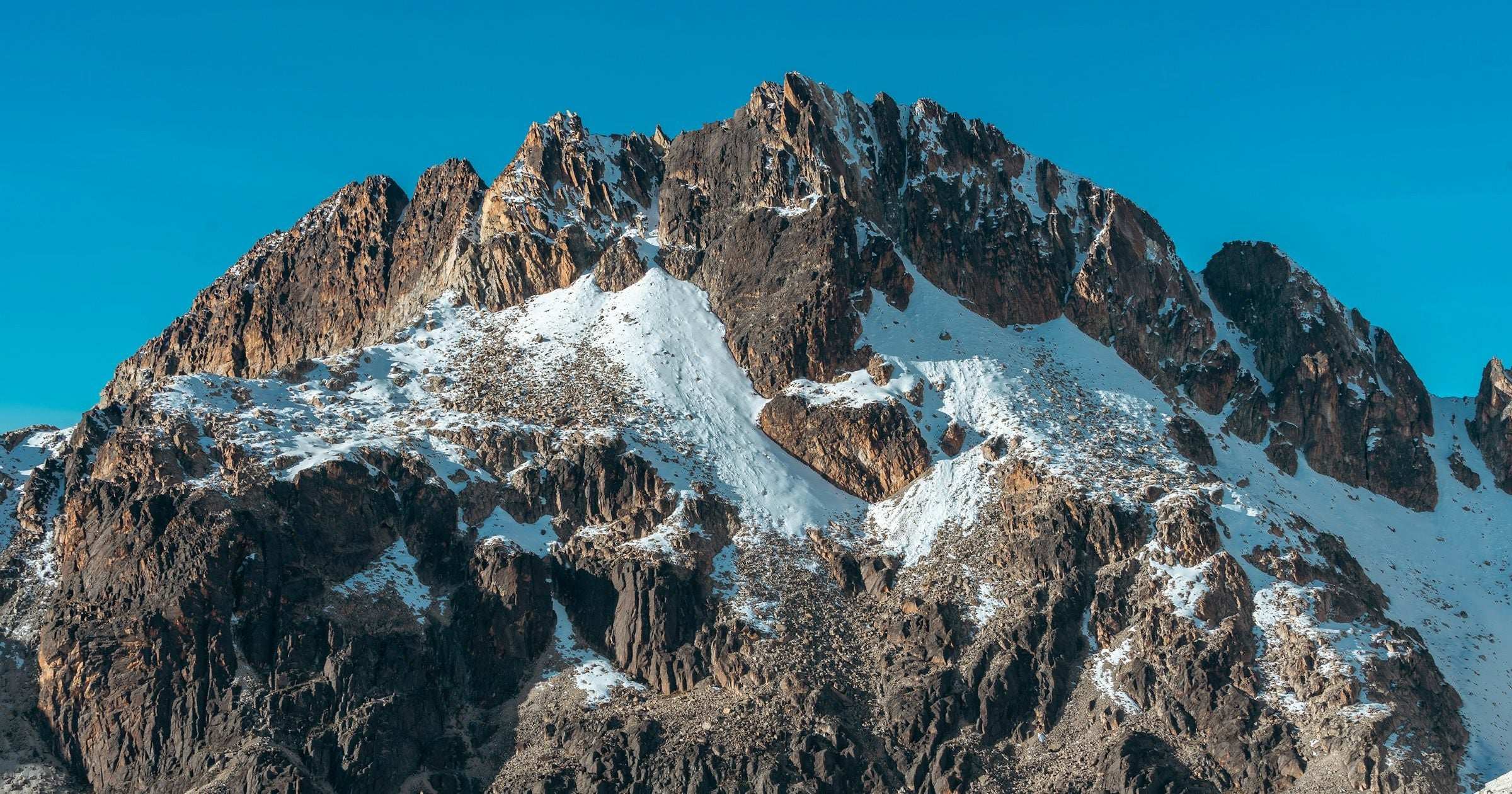 Snow-dusted Andean peak under a vivid blue sky, Latin America