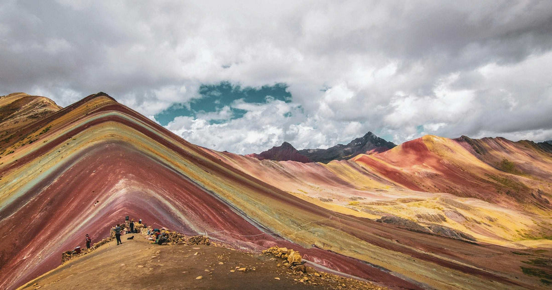 Rainbow Mountain Vinicunca with striated red yellow ochre slopes in Peruvian Andes