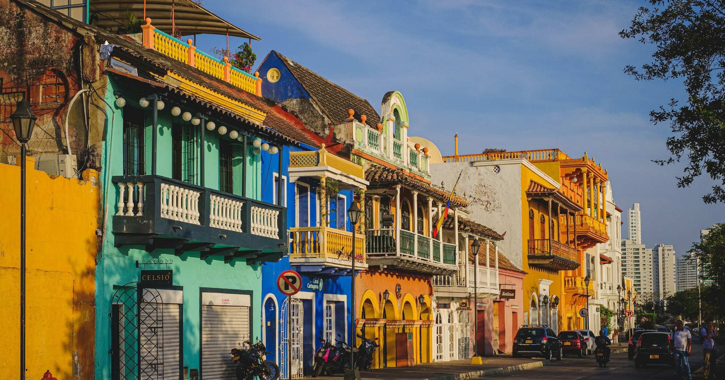 Colorful colonial architecture on a Cartagena street at golden hour — Colombia's tourist cities remain among Latin America's most welcoming destinations in 2026.