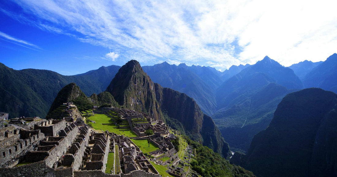 Machu Picchu citadel terraces under bright blue skies in the Peruvian Andes
