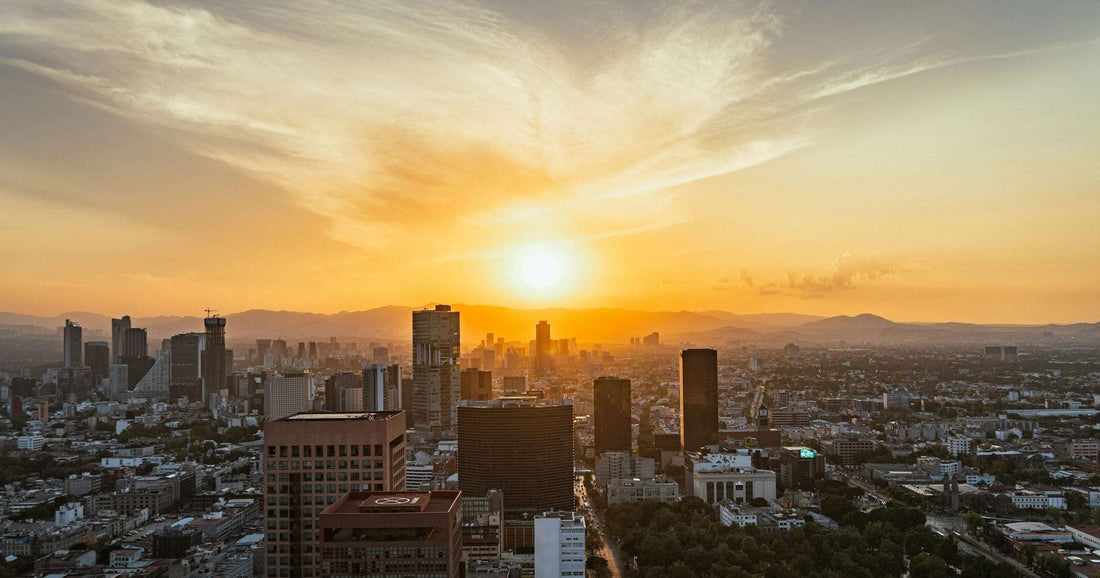 Mexico City skyline at sunset with distant mountains — a Latin America cityscape for comparing eSIM providers.