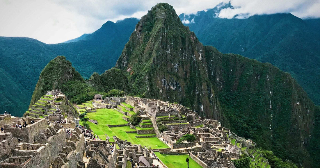 Machu Picchu Inca citadel with Huayna Picchu peak rising behind in the Peruvian Andes — the iconic destination for travellers exploring Peru with an eSIM.