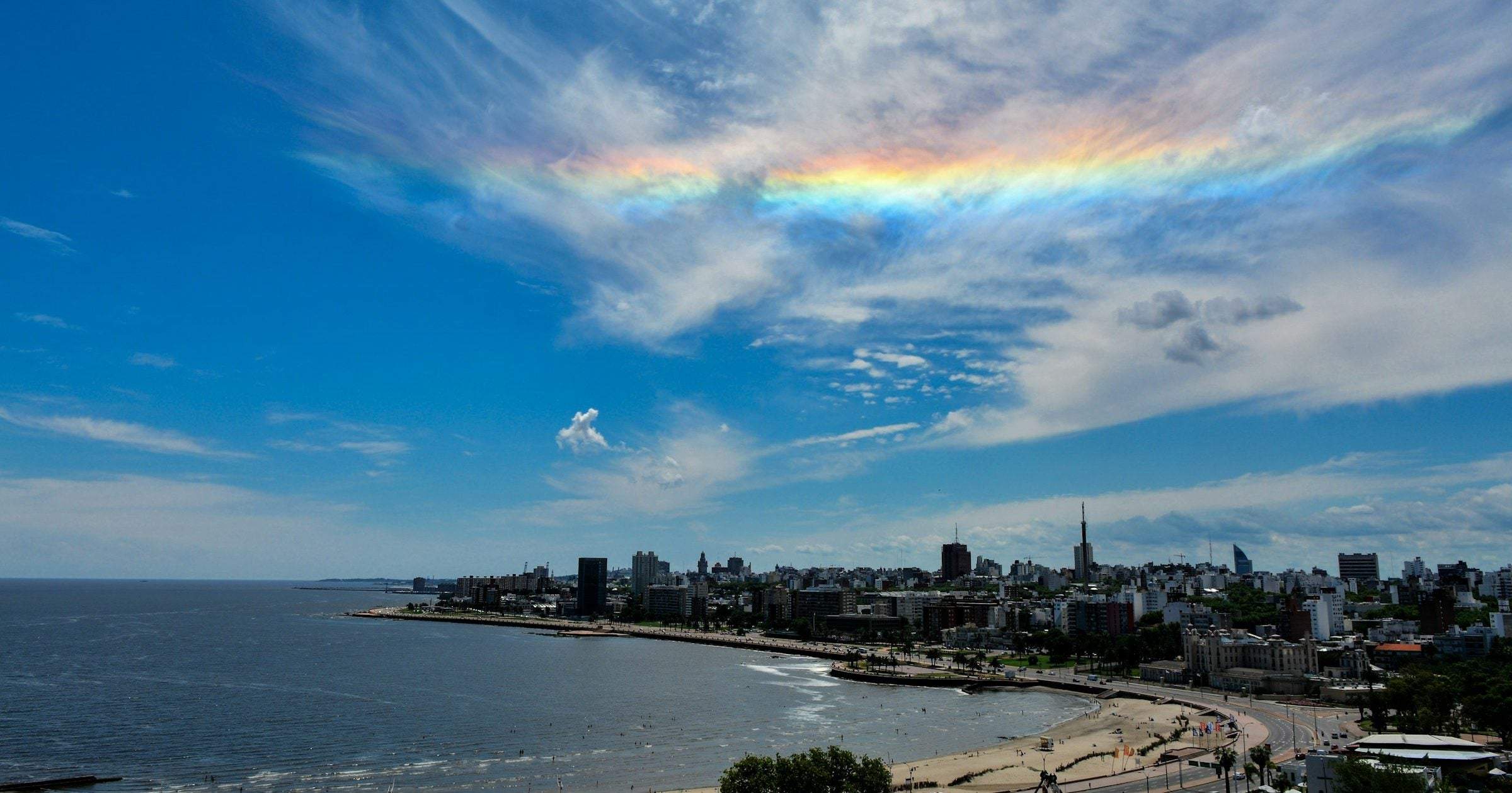 Montevideo coastline with a rare iridescent cloud over the skyline — Uruguay sits at US State Department Level 2 advisory in 2026, among South America's safest countries.